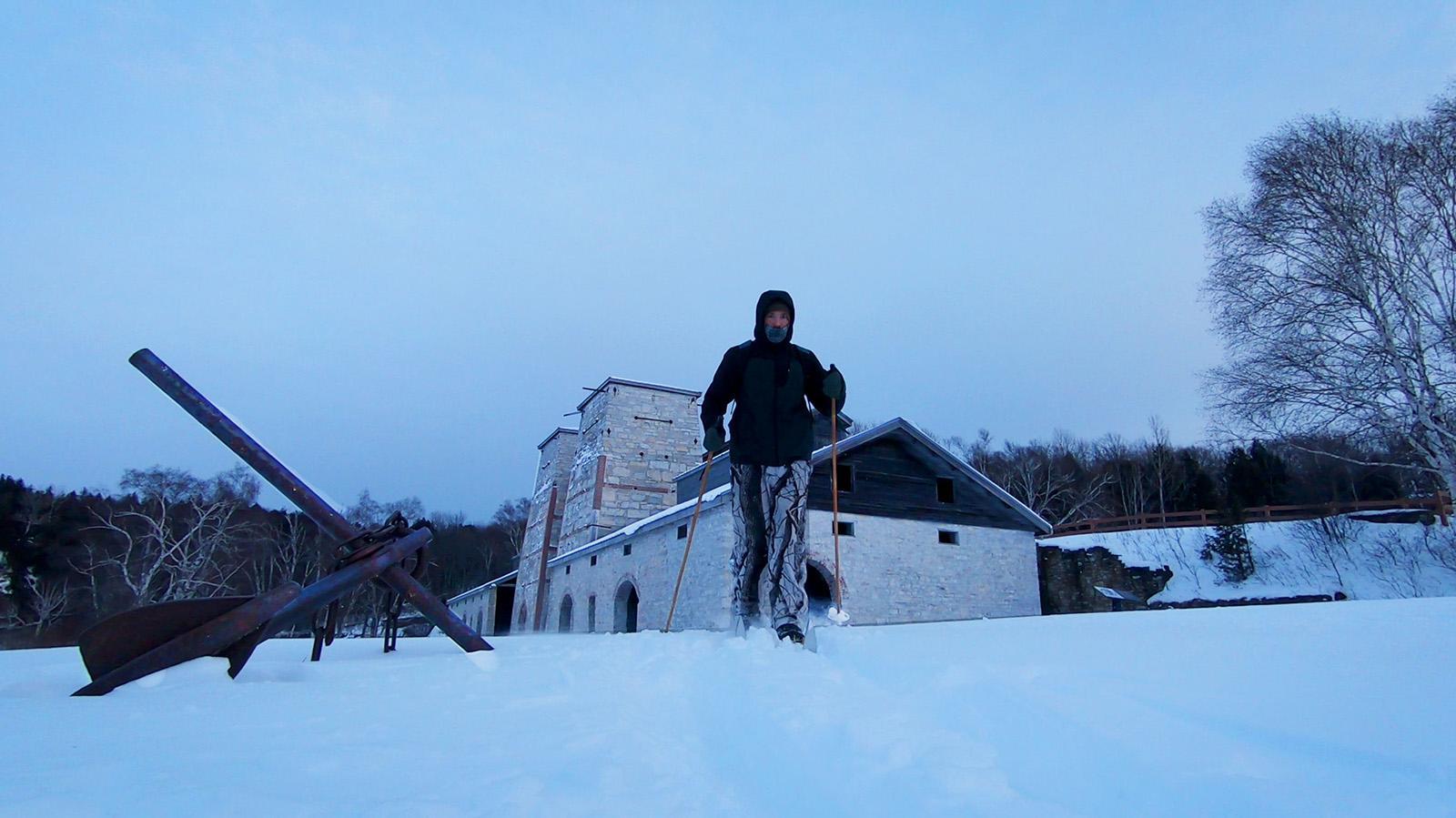 A person cross-country skiing through Fayette Historic Park