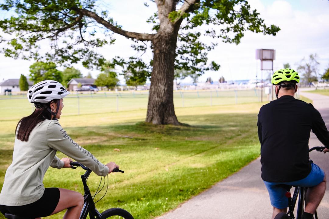 Two people on bikes in Van Cleve Park