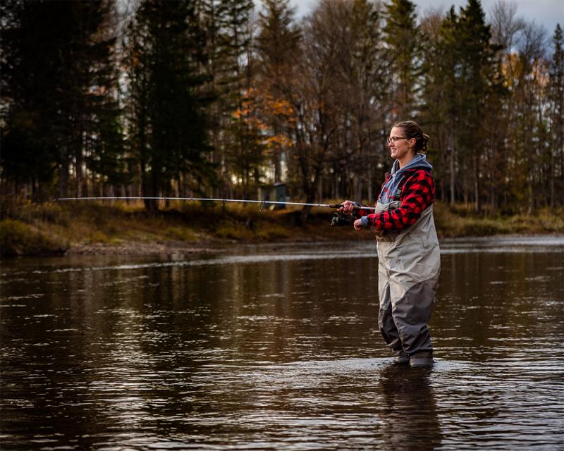 Person fishing in a river