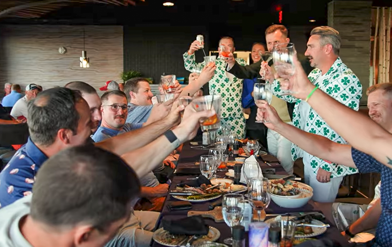 A group of friends celebrates together at a restaurant at Island Resort & Casino.