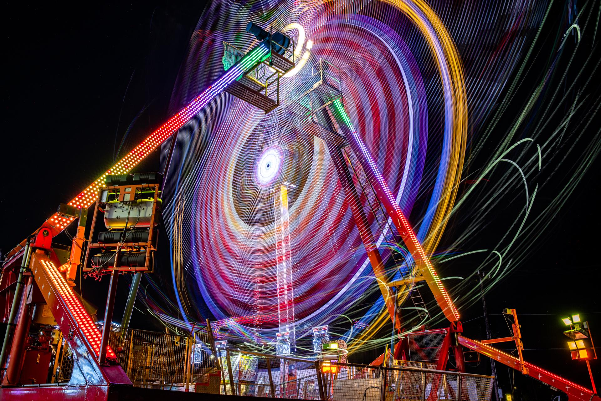 Ferris wheel blurred at night