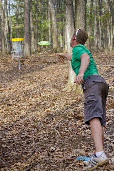 Playing disc golf