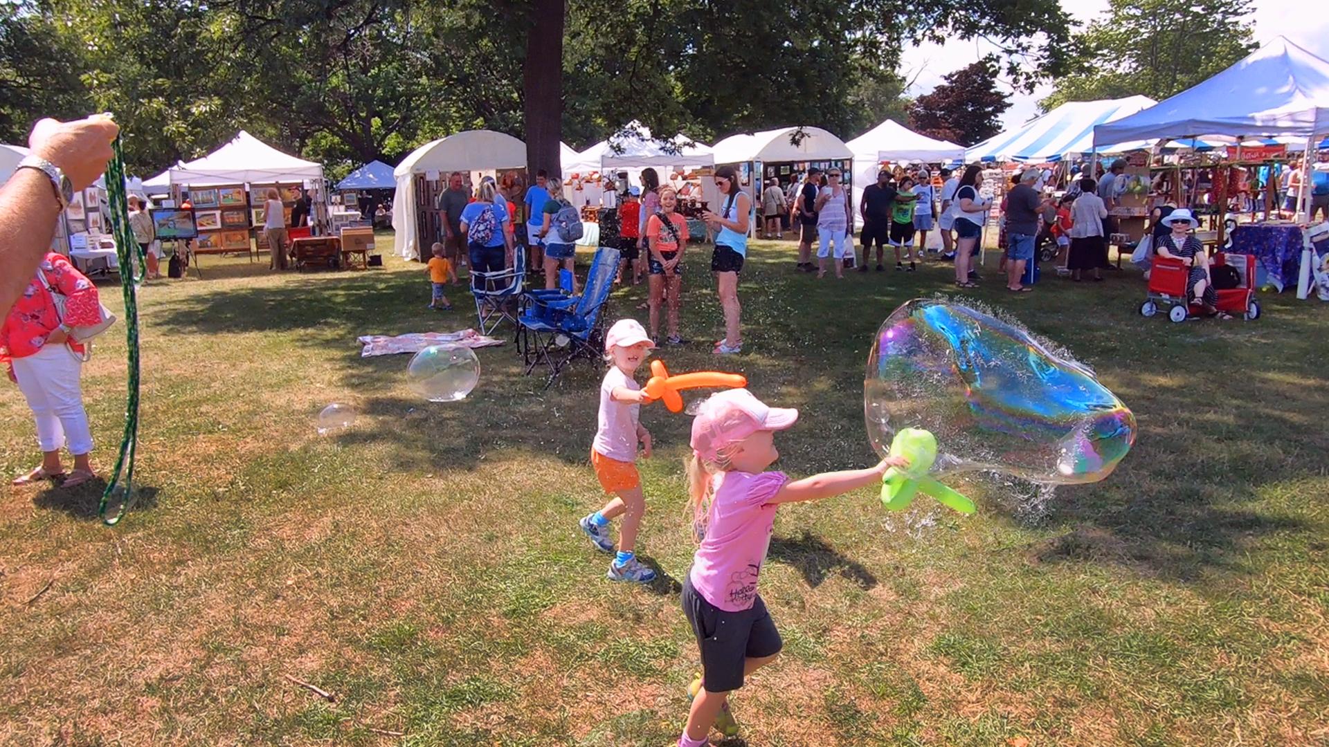 Girls popping bubbles