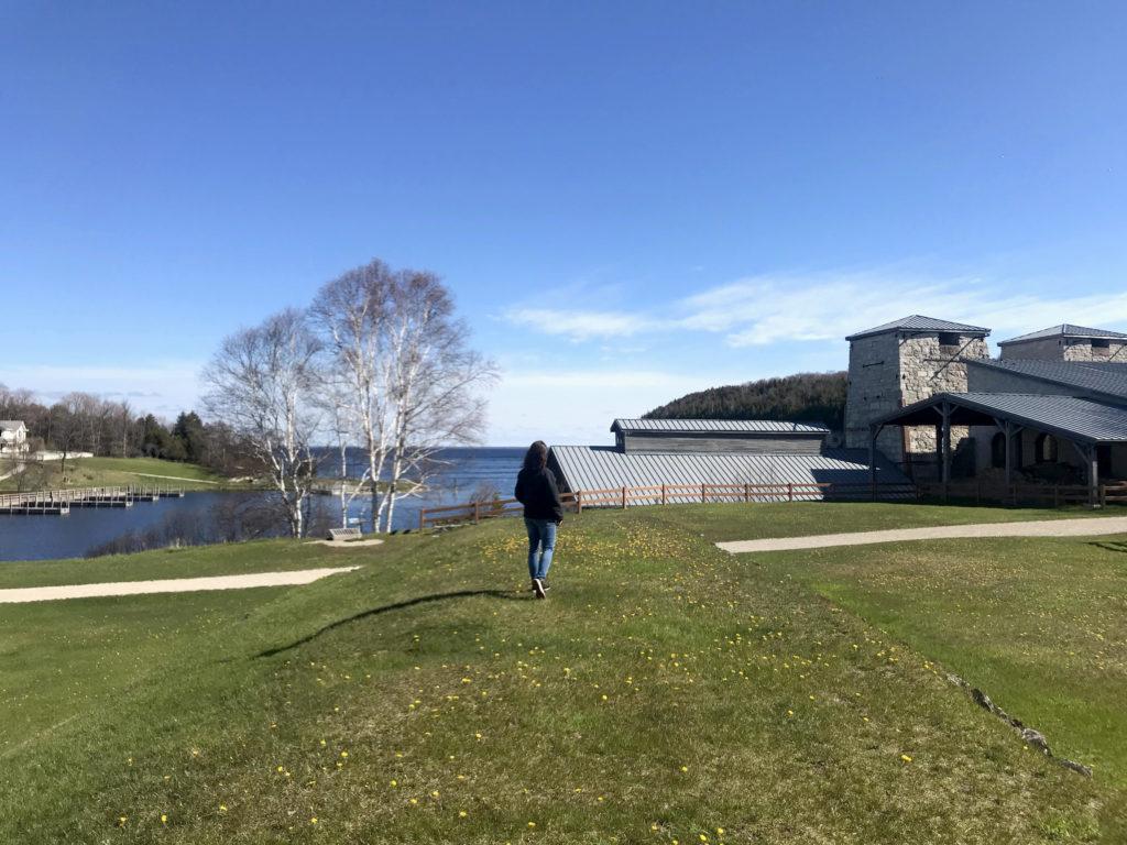 woman walking on fayette grounds