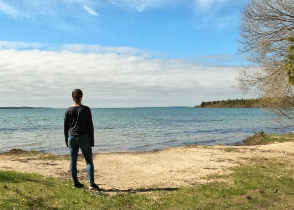 woman overlooking Sac Bay