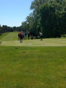 group of golfers on the course