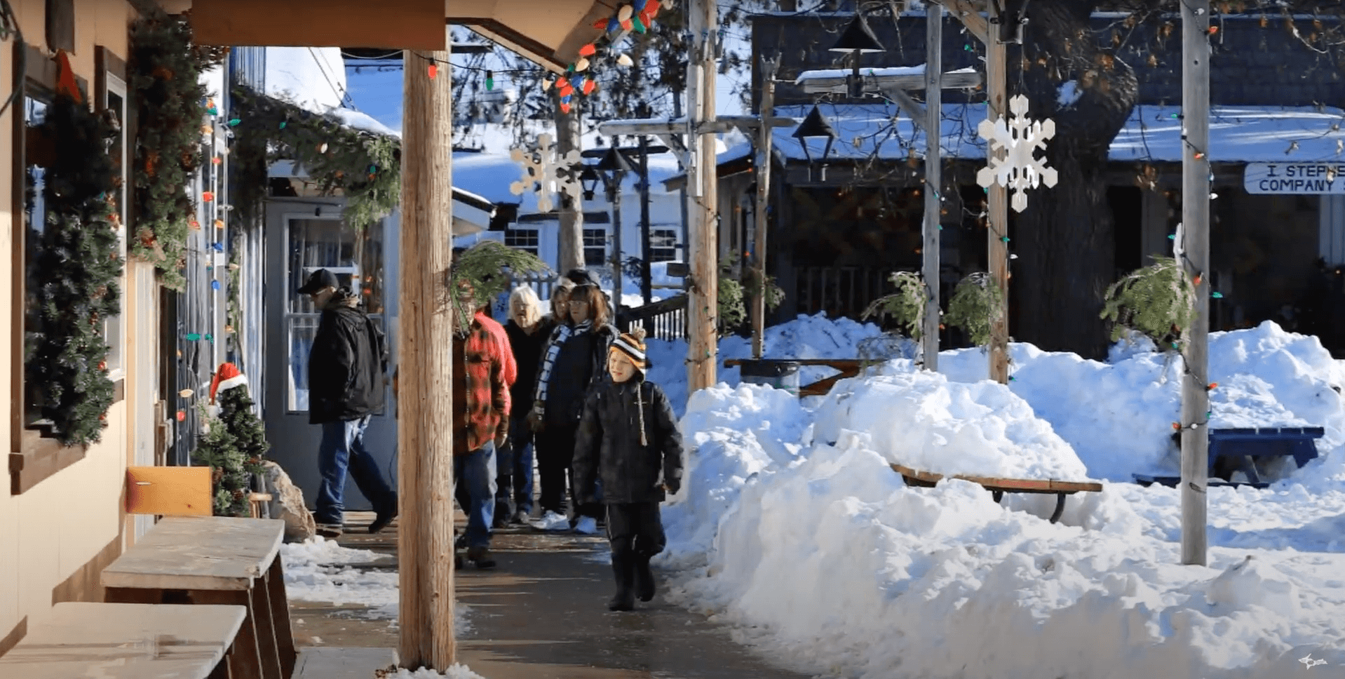 a kid walking down the sidewalk in Escanaba