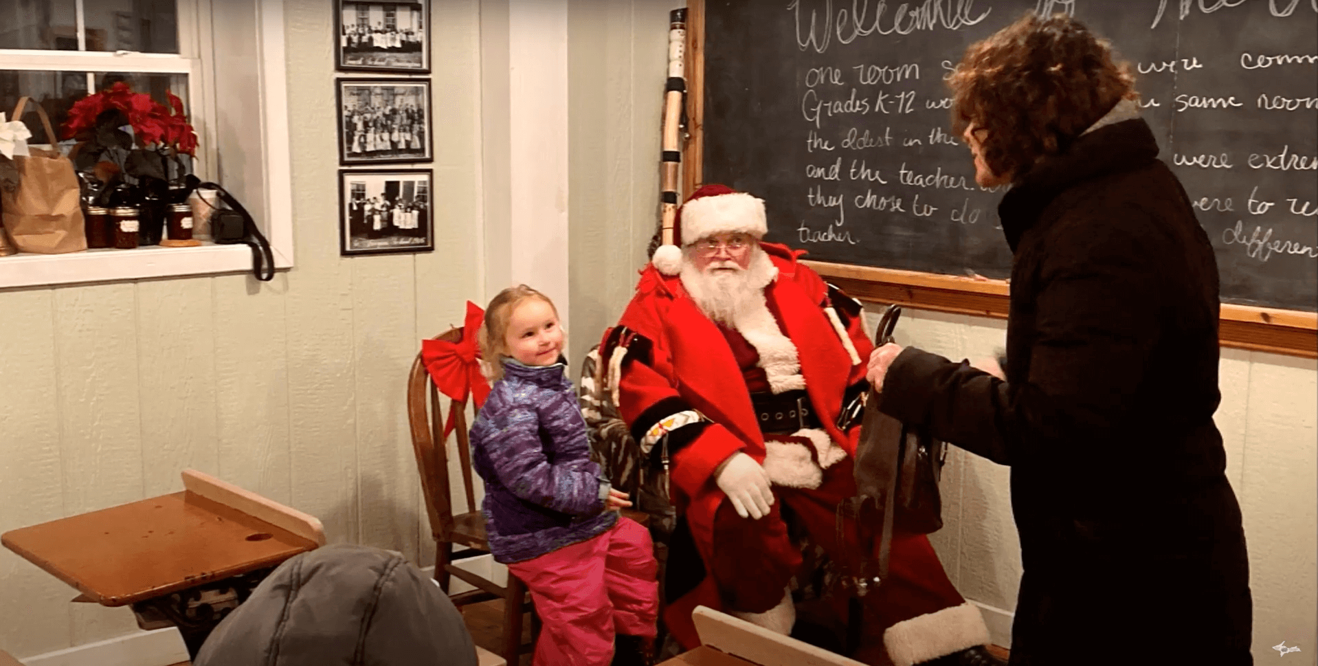 Santa listening to a child in Escanaba