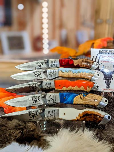 Custom Yooper folding knifes on display