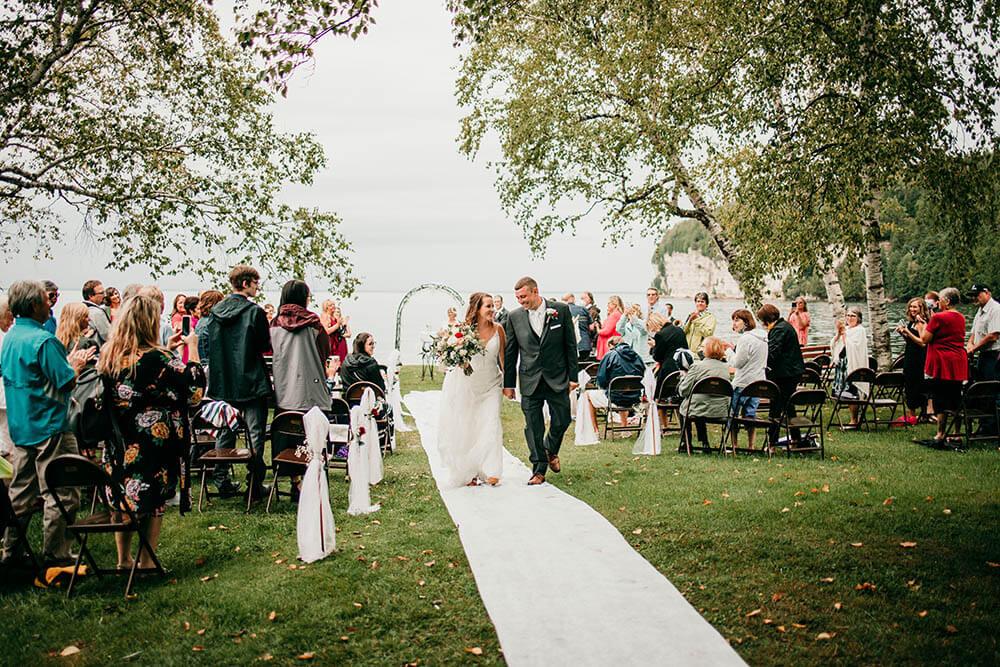 Wedding couple walking down aisle at Fayette