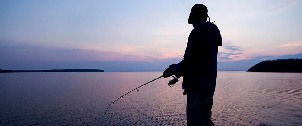 Person fishing on the Big Bays de Noc.